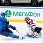 MINSK, BELARUS - MAY 13: Latvia's Edgars Masalskis #31 makes the save on  Kazakhstan's Roman Starchenko #48 during preliminary round action at the 2014 IIHF Ice Hockey World Championship. (Photo by Andre Ringuette/HHOF-IIHF Images)
